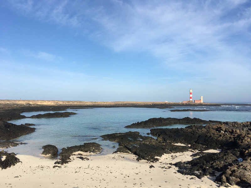 solid, beach, horizon over water, tower, sea, building exterior, rock - object, cloud - sky, rock, ideal, outdoors, blue, beauty in nature, guidance, scenics - nature