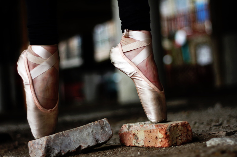 toes, ballet shoe, adult, pink, indoors, wearing, bricks, leather, human body part, one person, body part, ballerina, low section, balance, shoes, limb