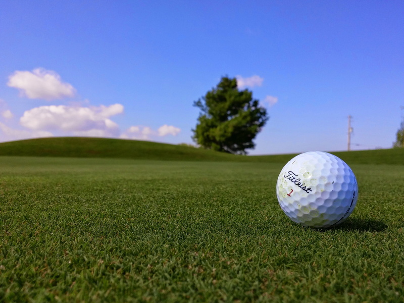 surface level, fun, summer, copy space, blue, outdoors, activity, nature, day, green, leisure activity, sunshine, Titleist, green - golf course, sphere