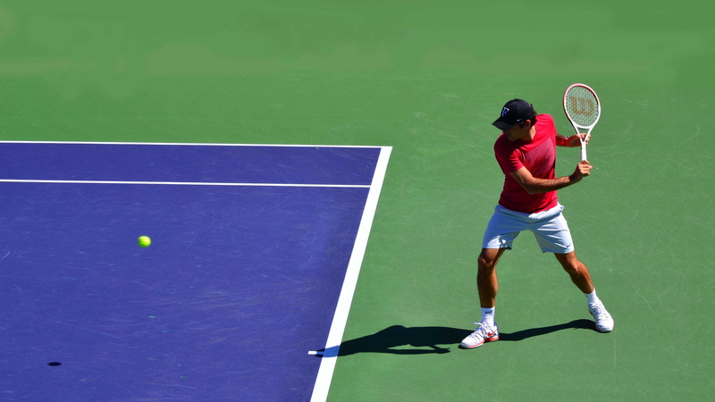federer, racket, taking a shot - sport, exercising, one person, young adult, roger federer, activity, lifestyles, motion, court, recreational pursuit, backhand