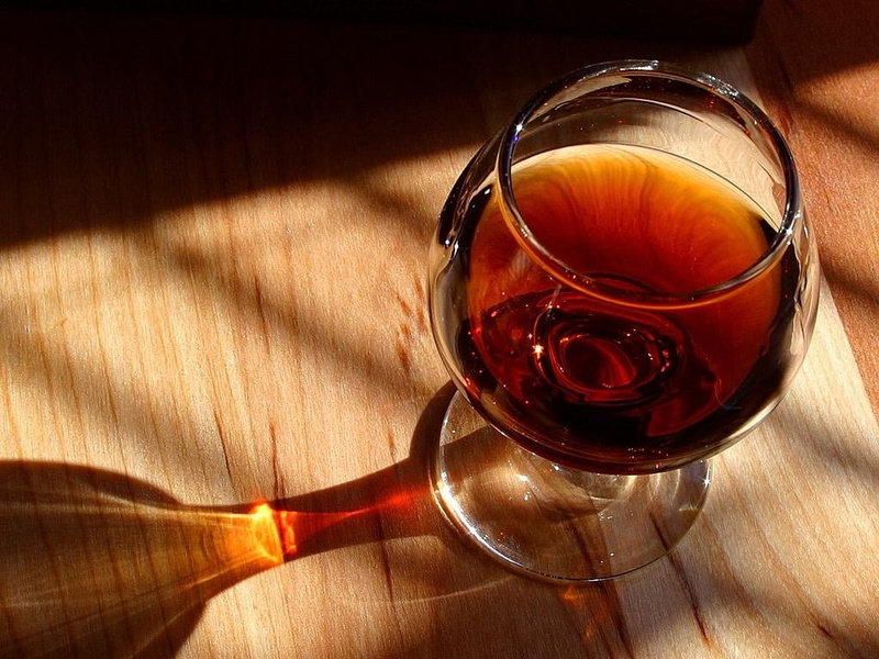 glass, brandy, alcohol, drinking glass, no people, red wine, wood grain, high angle view, wooden table, wineglass, household equipment, wine, cognac, freshness