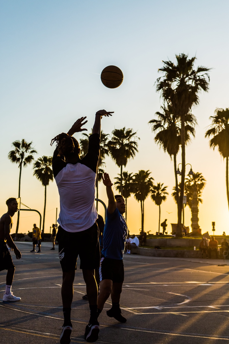 tree, man, rear view, sky, leisure, 5K, playing, full length, wear, sunset, sport, human arm, recreation, street, effort, skill, daylight, shooting, lifestyles