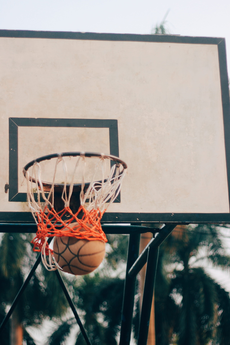 team sport, backboard, street, at the edge of, daytime, outdoors, game, making a basket, competition, close, 5K, court, basketball, sky, basketball - ball
