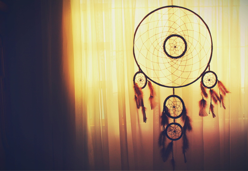 hanging, feathers, light - natural phenomenon, electric lamp, lighting equipment, no people, human representation, circle, clock, curtain, pattern, wall - building feature