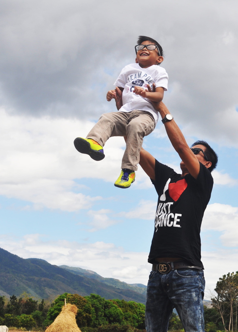 mountain, three quarter length, child, full length, men, outdoors, leisure activity, day, real people, cloud - sky, wear, sunglasses, carrying, two people