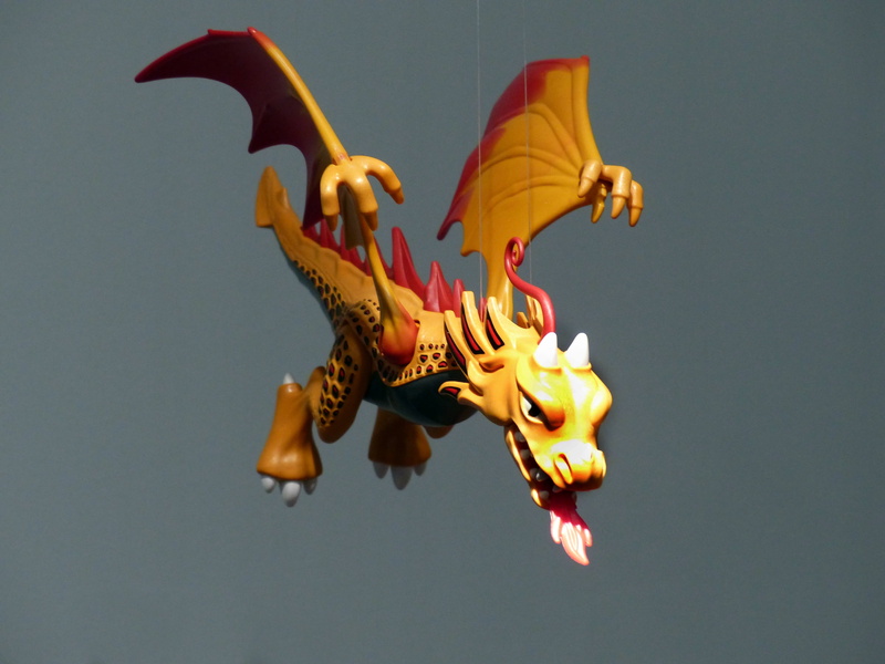 low angle view, toys, dragon, motion, flying, mythical creatures, studio shot, nature, animal, mid-air, fantasy, playmobil, indoors, gray, gray background