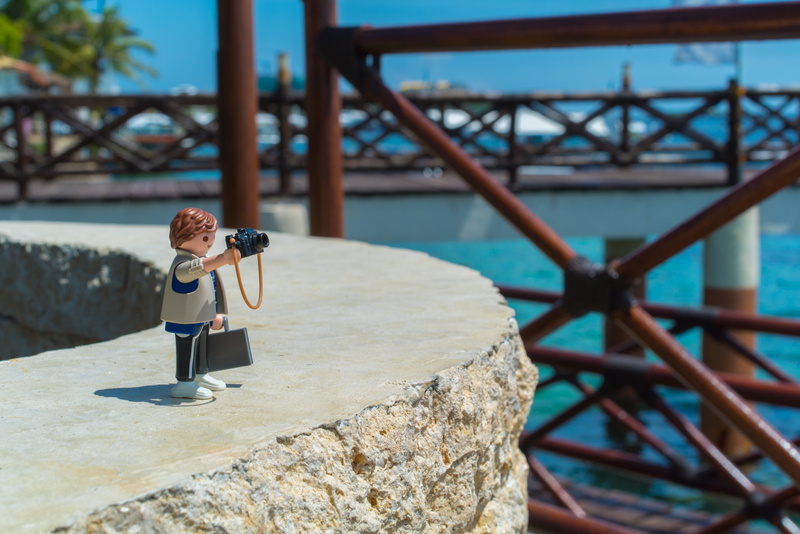 lifestyles, full length, architecture, photographers, holding, beach, sea, toy, outdoors, playmobil, shooting, leisure activity, metal, photography, built structure