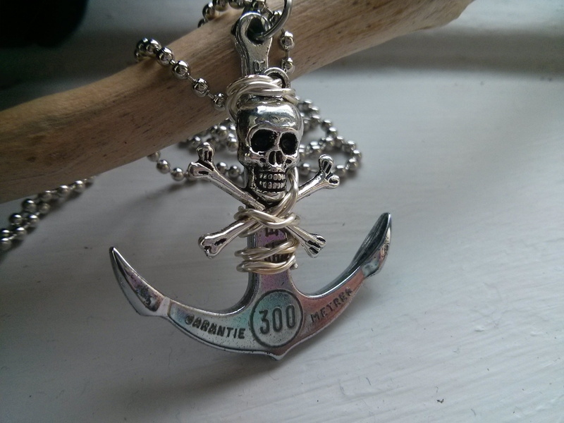 still life, skull, indoors, table, focus on foreground, wood - material, design, personal accessory, metal, holding, chain, Anchor, no people, Skull And Crossbones