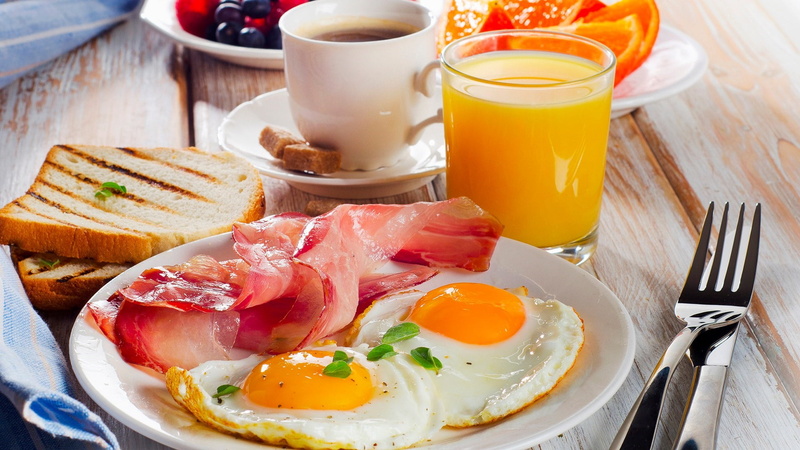 egg yolk, table knife, pork, fork, meal, toast, healthy eating, bacon, no people, breakfast, bread, fried, meat, table, sunny side up, ready-to-eat, food