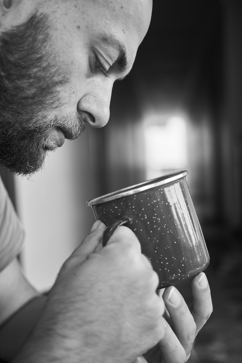 cup, refreshment, tea cup, human face, close-up, exposure, contact, 8K, photo, drinking, indoors, coffee cup, product photo, holding, human hand, hand