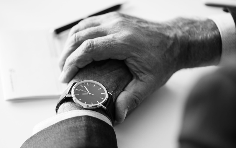 caucasian, black and white, one person, pocket watch, value, indoors, close-up, finger, white background, event, task, guidance, man, senior adult, wrists