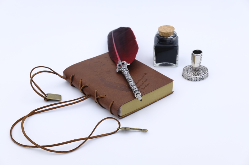 white background, cut out, telephone, leather, fountain pen, fashion, feather, high angle view, connection, white color, jewelry, ink, letters, black color