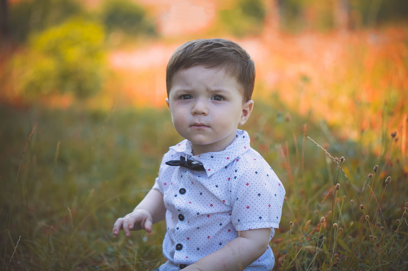 child, outdoors, grass, innocence, lifestyles, day, baby, casual clothing, wearing, white, portrait, summer, focus on foreground, cute, looking, field