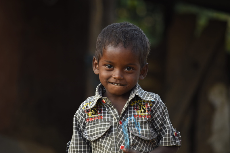 focus on foreground, smiling, child, looking at camera, focus, checked pattern, collared, photography, eyes, fashion, boys, men, young, casual clothing