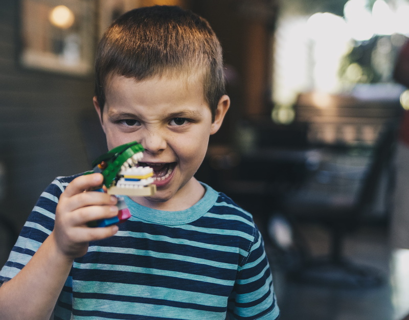 temptation, focus, casual clothing, wearing, photography, innocence, shirt, child, caucasian Ethnicity, males, indoors, headshot, men, one boy only, eating
