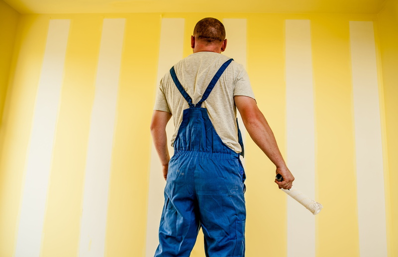 corporation, rear view, males, worker, employee, adult, safety, one person, working, yellow, mature adult, professional, male, indoors, men, holding, factory