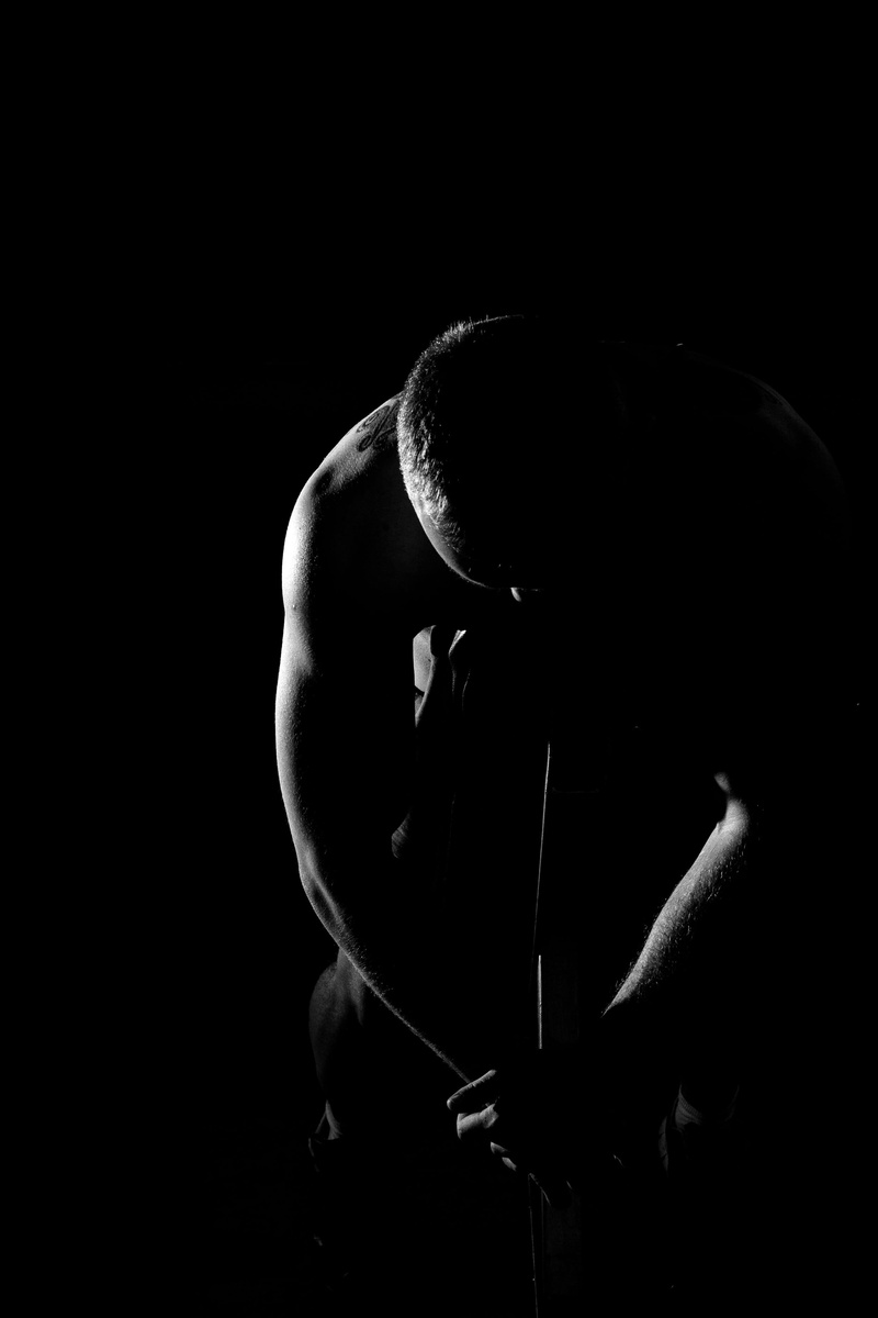 dark, domestic room, man, attempt, indoors, athlete, darkroom, 2K, music, sitting, depression - sadness, studio shot, portrait, headshot, aspiration, copy space