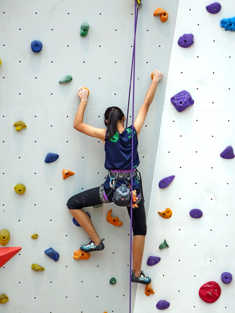 activity, safety harness, climbing, training, climbing wall, recreation, rope, effort, wall, hand, indoors, indoor, full length, lifestyles, conquering adversity