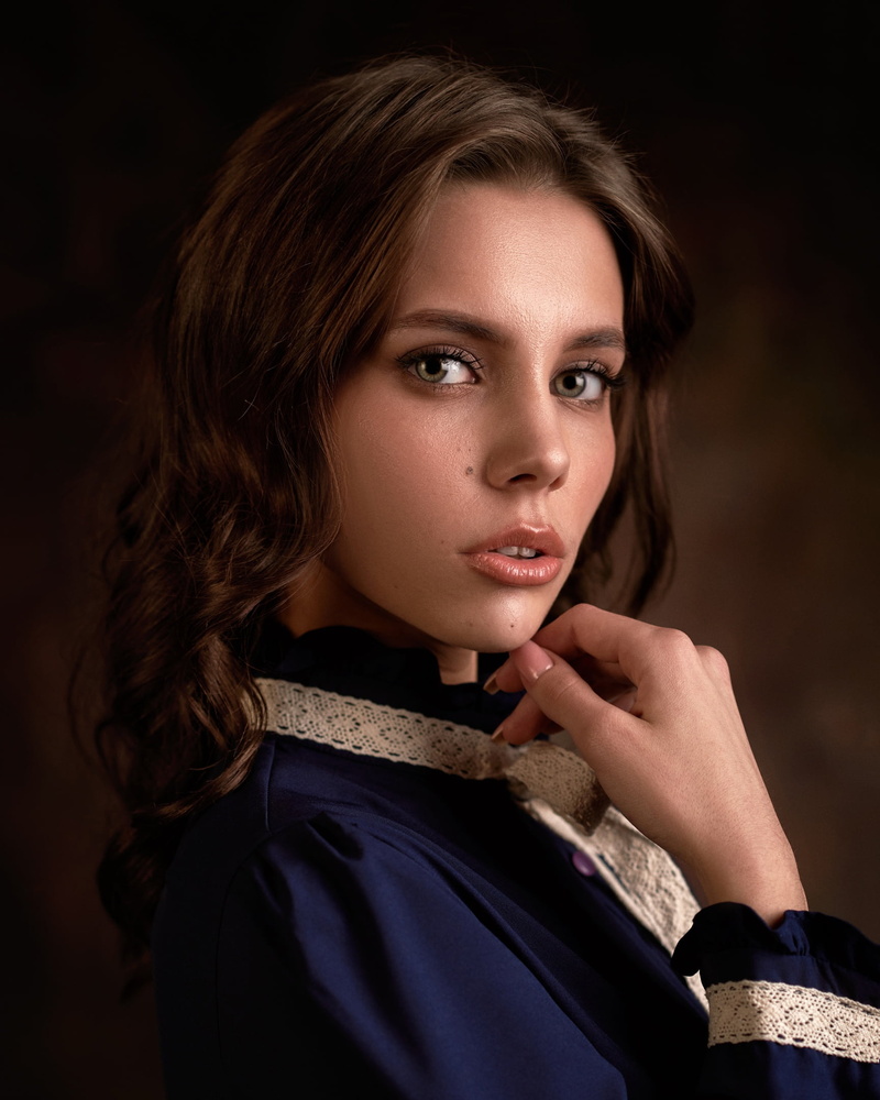 Maria Rykova, simple background, women, wavy hair, shoulder length hair, portrait, parted lips, brunette, blue clothing, makeup, 1080P, looking at viewer