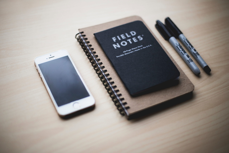 connection, indoors, table, touch Screen, gold, smart Phone, equipment, notebook, pen, copy Space, communication, two, desk, black color, spiral notebook