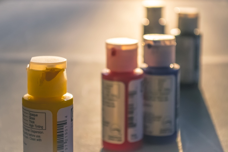 group of objects, yellow, prescription medicine, healthcare and medicine, education, indoors, bottles, selective focus, bottle, paint, container, pill