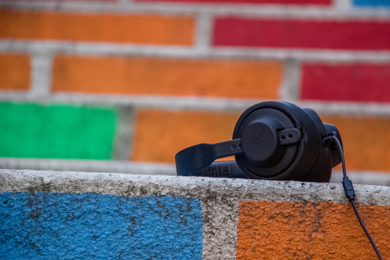 focus on foreground, corded, building exterior, 5K, headphones, technology, wall - building feature, outdoors, brick wall, brick, architecture, orange color