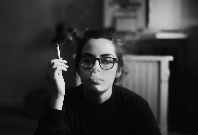 contemplation, front view, portrait, women, cigarette, looking at camera, smoking, women with glasses, one person, smoking issues, holding, activity, focus on foreground