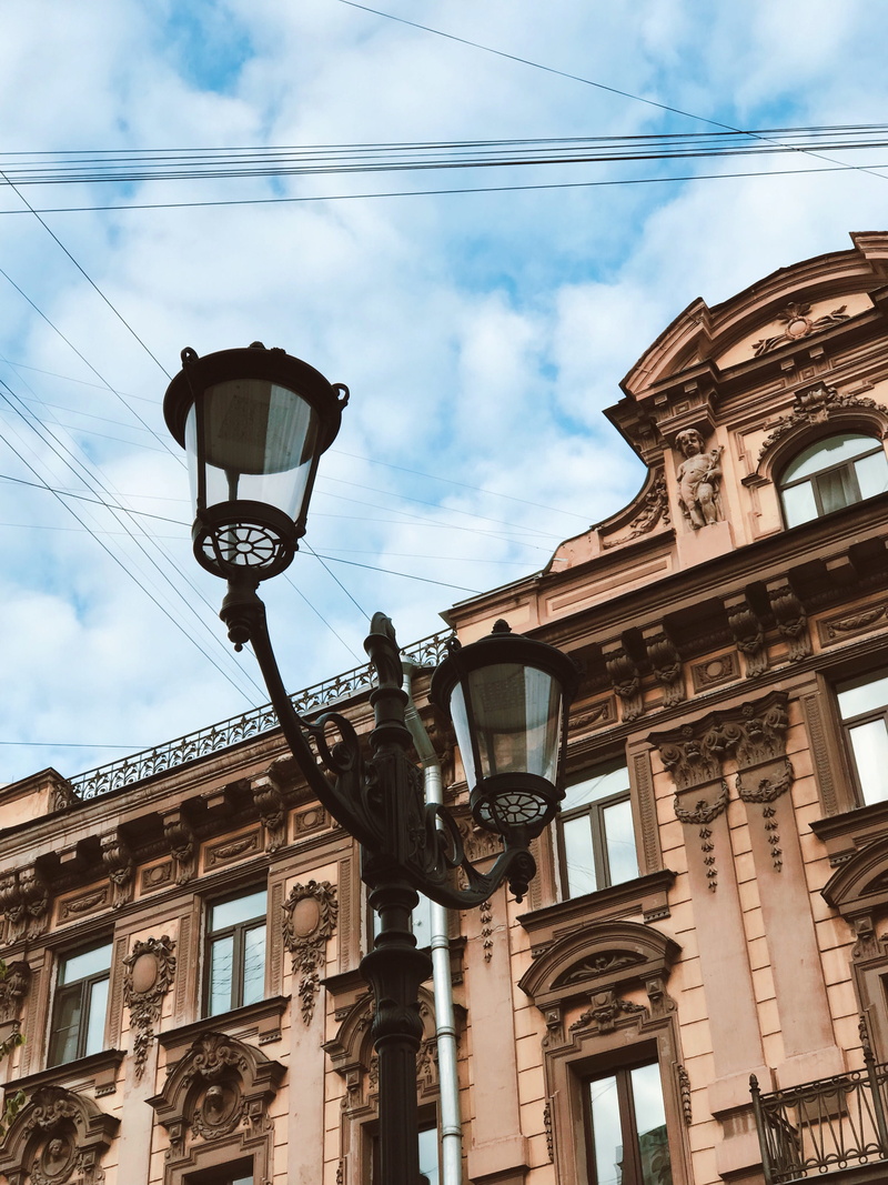 building, city gate, outdoors, man, nature, architecture, electric lamp, cloud, light, electricity, lamp post, lighting equipment, feel, feels, street