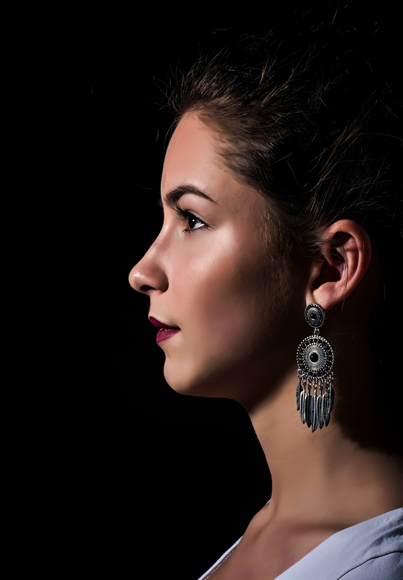 young women, women, emotion, studio shot, woman, skin, facial, girl, holding, headshot, adult, one person, expression, looking away, earrings, looking
