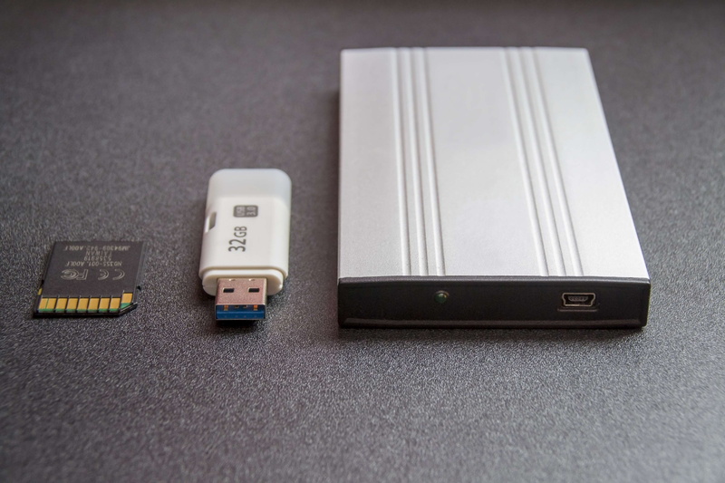 memory stick, technology, data archiving, high technology, mobile hard drive, no people, table, remote control, contemporary media, computer accessories