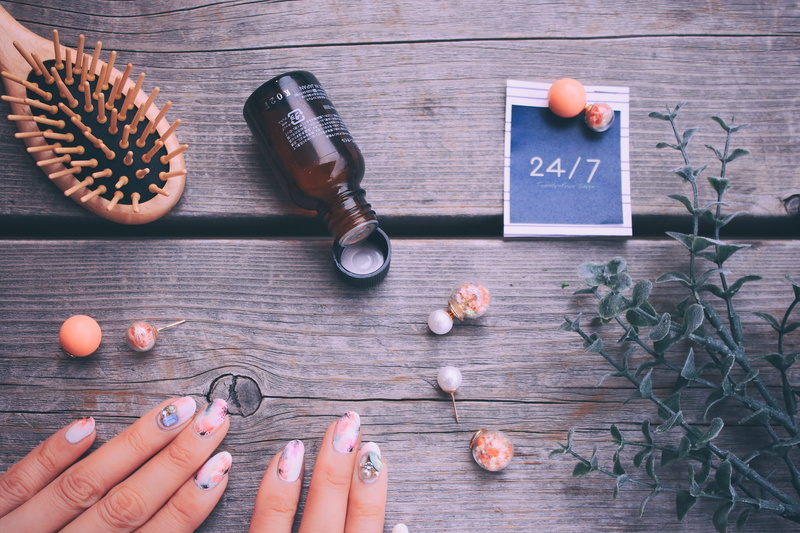 nail, bottle, glass bottle, high angle view, finger, one woman only, near, holding, indoors, human Hand, food, food and drink, glass, hand, communication