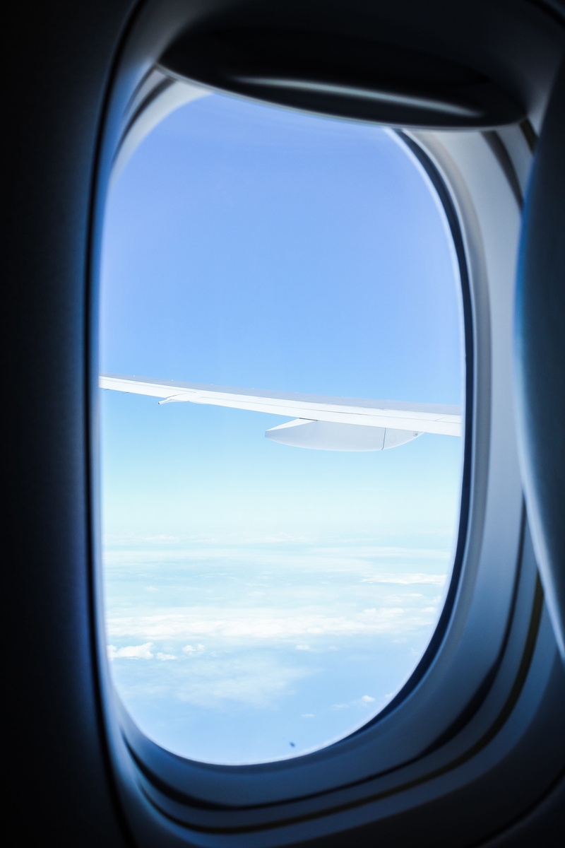 window shade, skylight, aircraft, building, shipping container, shutter, mode of transportation, text, glass - material, view, air vehicle, vehicle, flying