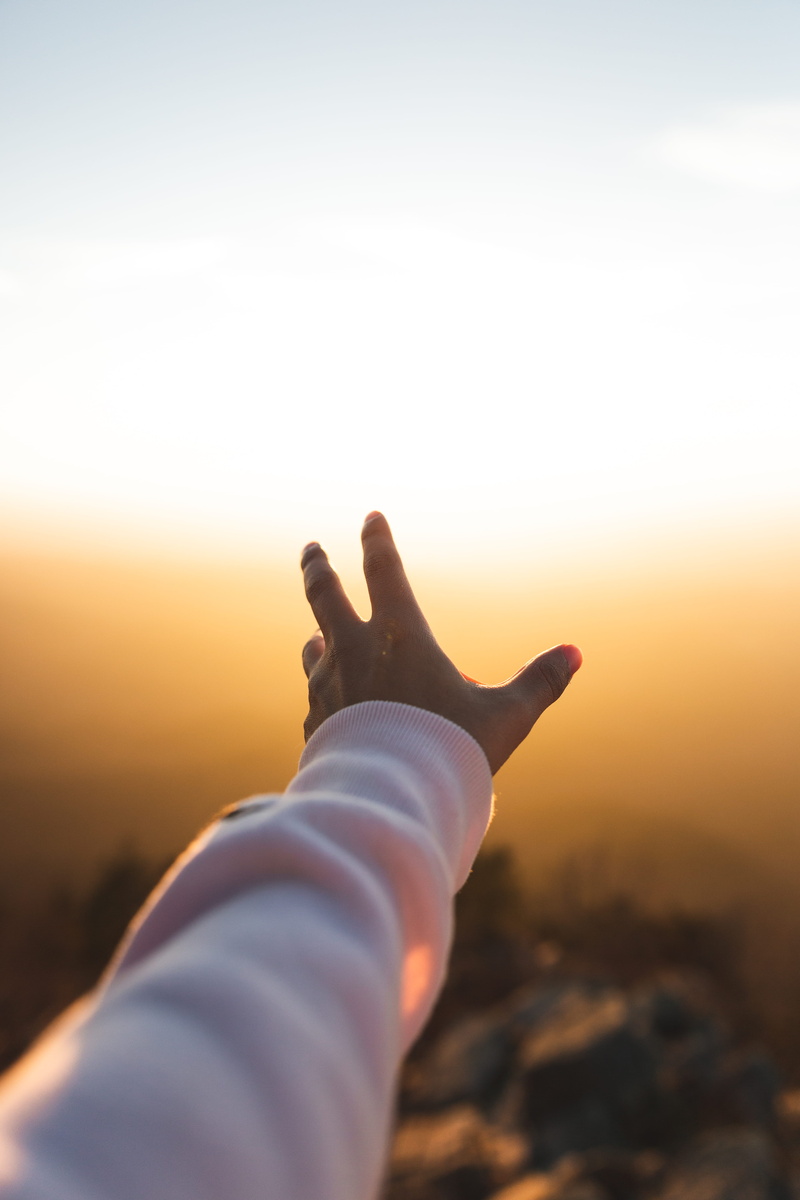 left, real people, nature, lifestyles, one person, hand, sunlight, earth, focus on foreground, vibrant photos, leisure activity, sunset, copy space, outdoors