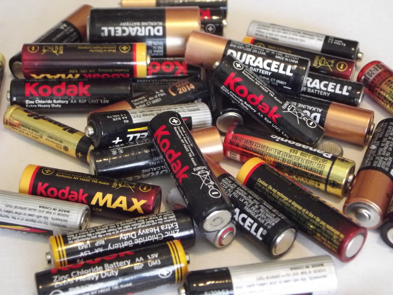 focus on foreground, close-up, low power consumption, text, variation, social issues, indoors, rechargeable battery, high angle view, no people, large group of objects