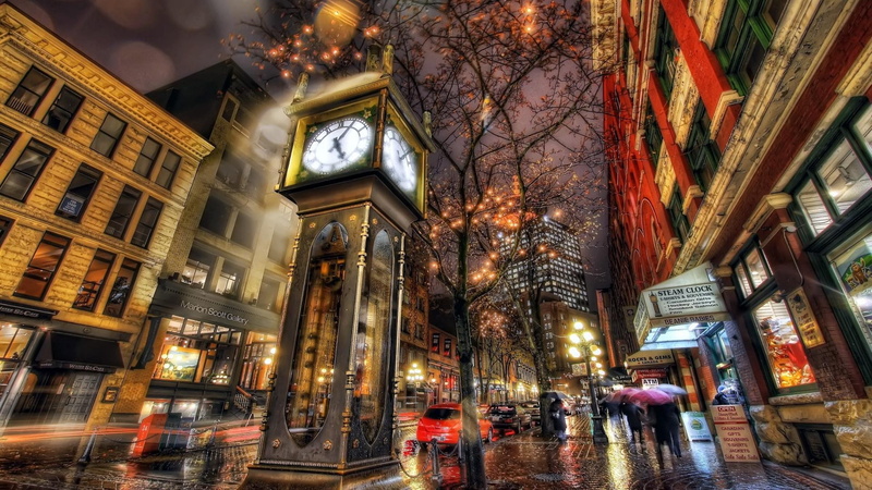 history, outdoors, incidental people, city, tree, built structure, lighting equipment, low angle view, street, illuminated, building exterior, city life