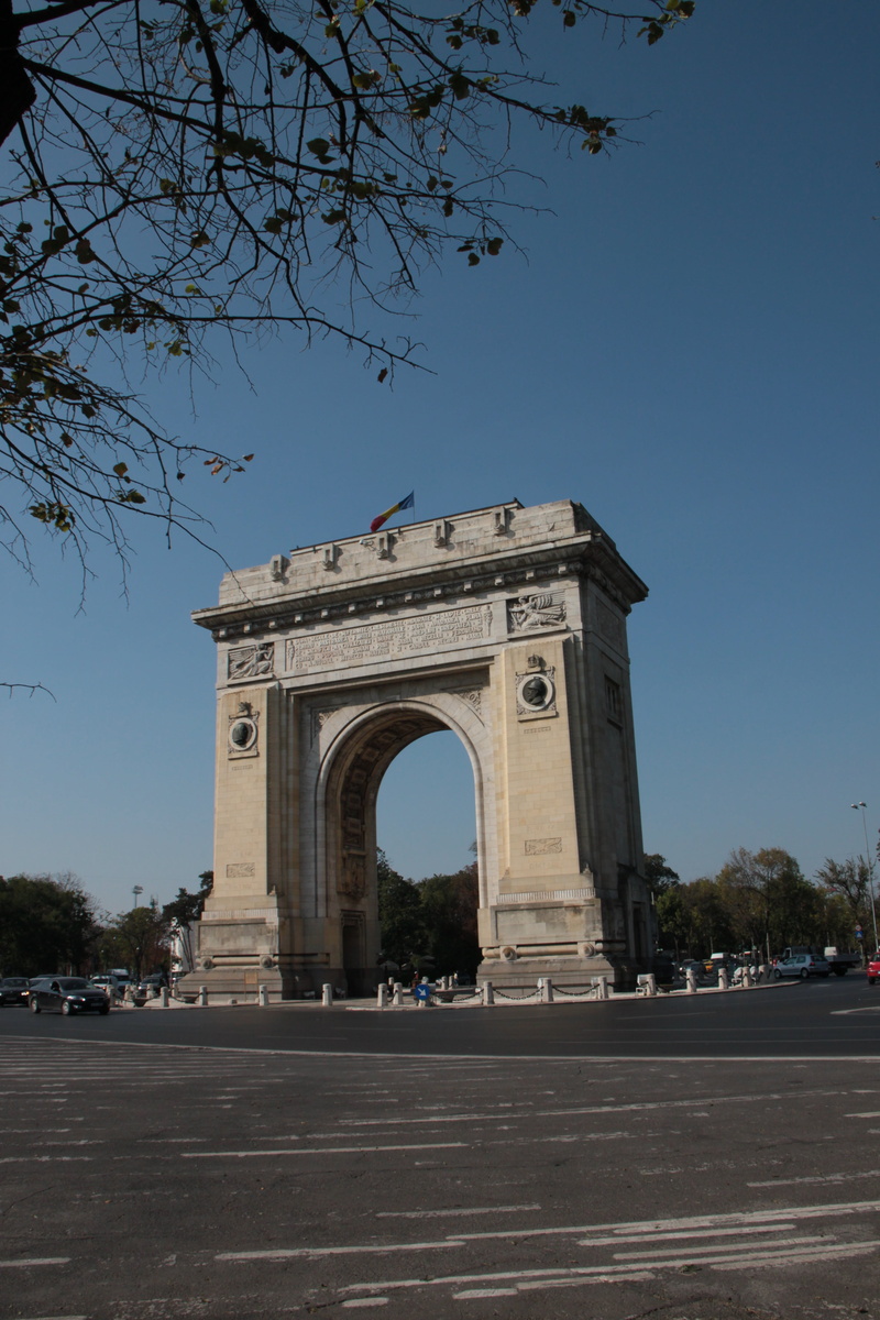 day, built structure, travel destinations, no people, city, outdoors, the past, nature, monuments, arch, clear sky, plant, sky, bucharest, architecture