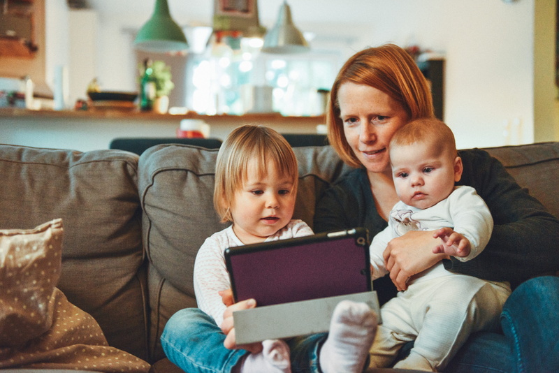 couch, girl, carrying, table, watching, daughter, children, females, facetime, 5K, cushion, two, mother, furniture, sitting, lifestyles, looking, wireless technology