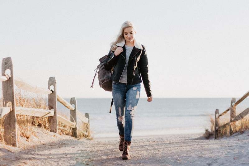 walking, hair, happiness, jeans, nature, zip, warm clothing, young adult, blonde hair, denim jeans, casual clothing, beautiful woman, 2K, black leather jacket