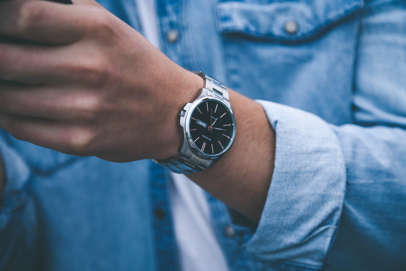 indoors, finger, wearing, focus on foreground, person, close-up, young adult, human hand, human limb, casual clothing, front view, midsection, wristwatch