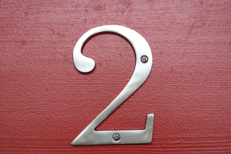 silver colored, emblem, silver, door, lock, protection, number 2, two, gray, directly above, white color, security, safety, number, metal, day, 4K, wall - building feature