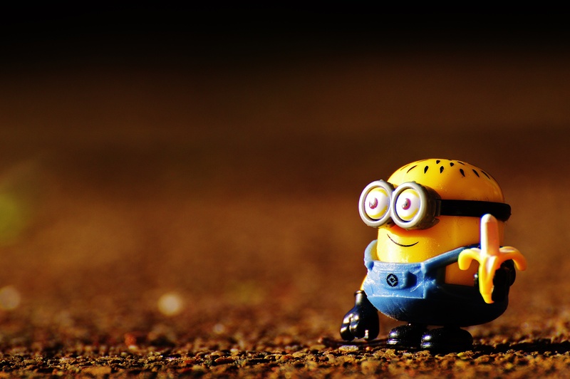  cute, representation, 5K, still life, table, single object, close-up, funny, toys, selective focus, human representation, toy car, focus on foreground