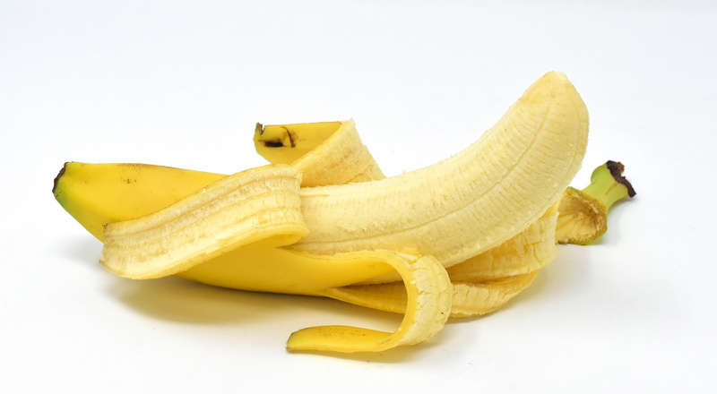 indoors, fruit, vitamins, sign, studio shot, single object, fruits, eat, snack, sweet, banana, food and drink, fun, banana peel, humor, no people, slippery