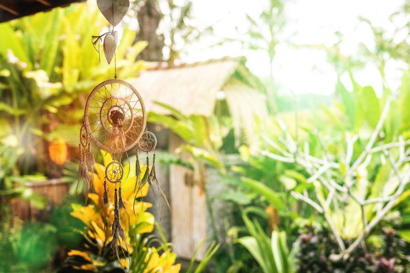 land, animal themes, close-up, no people, weaving, leaf, animal, plant, focus on foreground, art and craft, decoration, feathers, day, hanging, nature