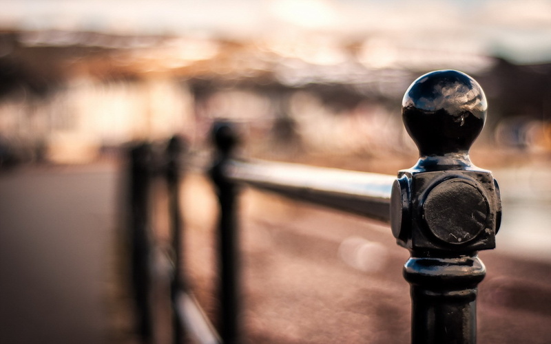 focus on foreground, railing, nature, fence, safety, boundary, bokeh, security, black color, depth of field, lighting equipment, coin operated, metal, selective focus
