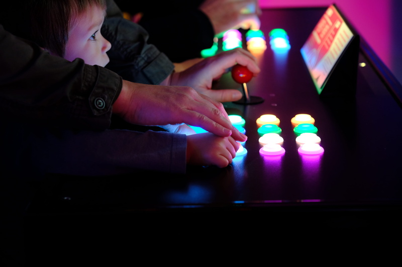 boy, illuminated, table, playing, 5K, indoors, nightlife, arcade, technology, child, real people, leisure activity, concentration, dark, casino, relaxation