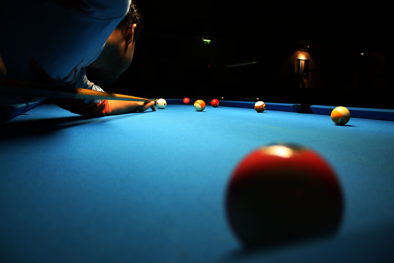 bending, pool cue, relaxation, sport, one person, skill, aiming, indoors, pool hall, cue billiards, pool, competition, table, snooker, pool - cue sport