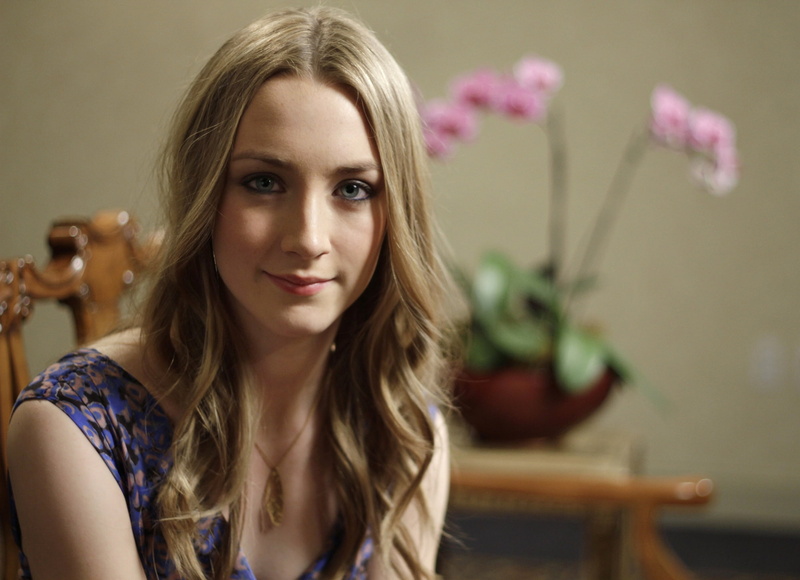 hairstyle, beauty, one person, women, contemplation, focus on foreground, flowering plant, actress, looking at camera, hair, smiling, portrait, Saoirse Ronan