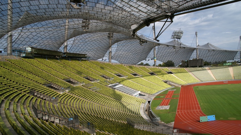 built structure, team sport, empty, 2K, munich, stadium, absence, grass, sunlight, day, no people, olympic stadium, outdoors, architecture, seat, nature