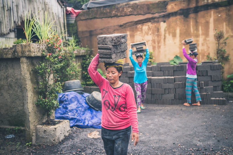 concrete blocks, stack, person, ladies, holding, child, adult, men, emotion, carry, photography, labor, three quarter length, female, cinder, women, bonding