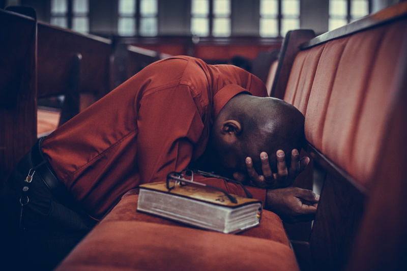 head, lying down, prayer, portrait, ieadern, sadness, eyeglasses, glasses, adult, window, religion, book, worship, architecture, assembleia de deu, men
